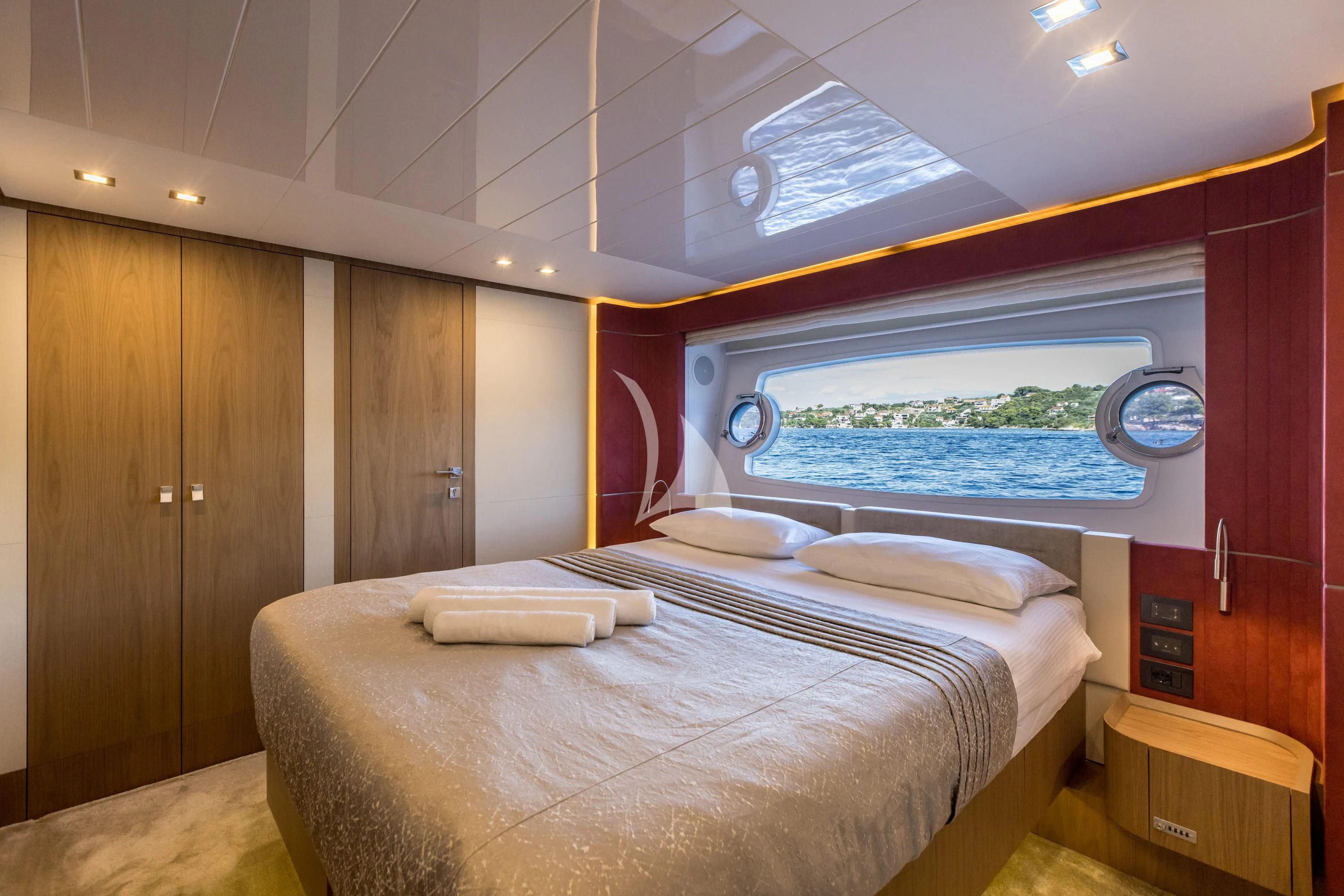 a room with a bed and a window aboard KATARIINA XO Yacht for Sale