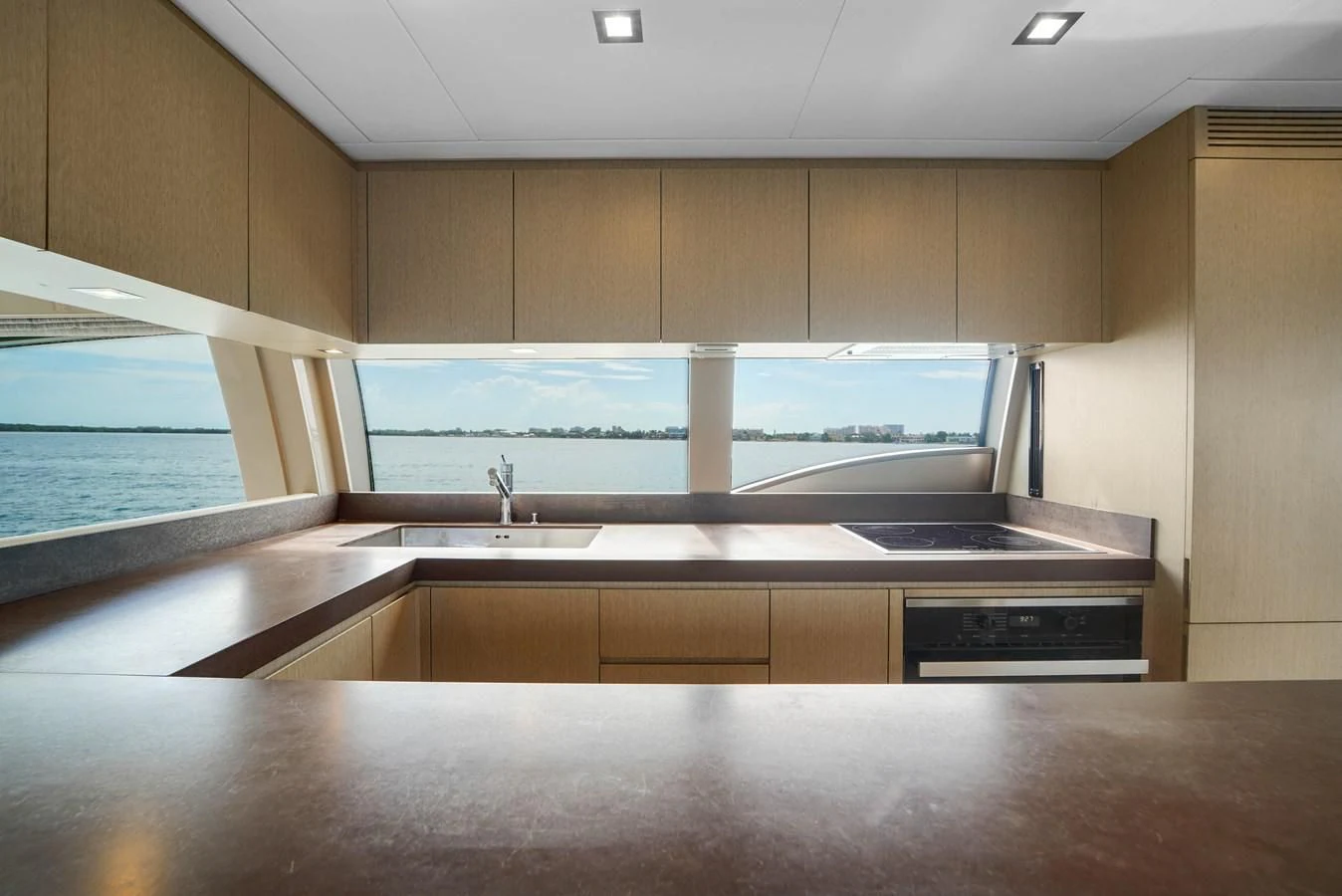 a kitchen with a large glass window aboard KATARIINA XO Yacht for Sale