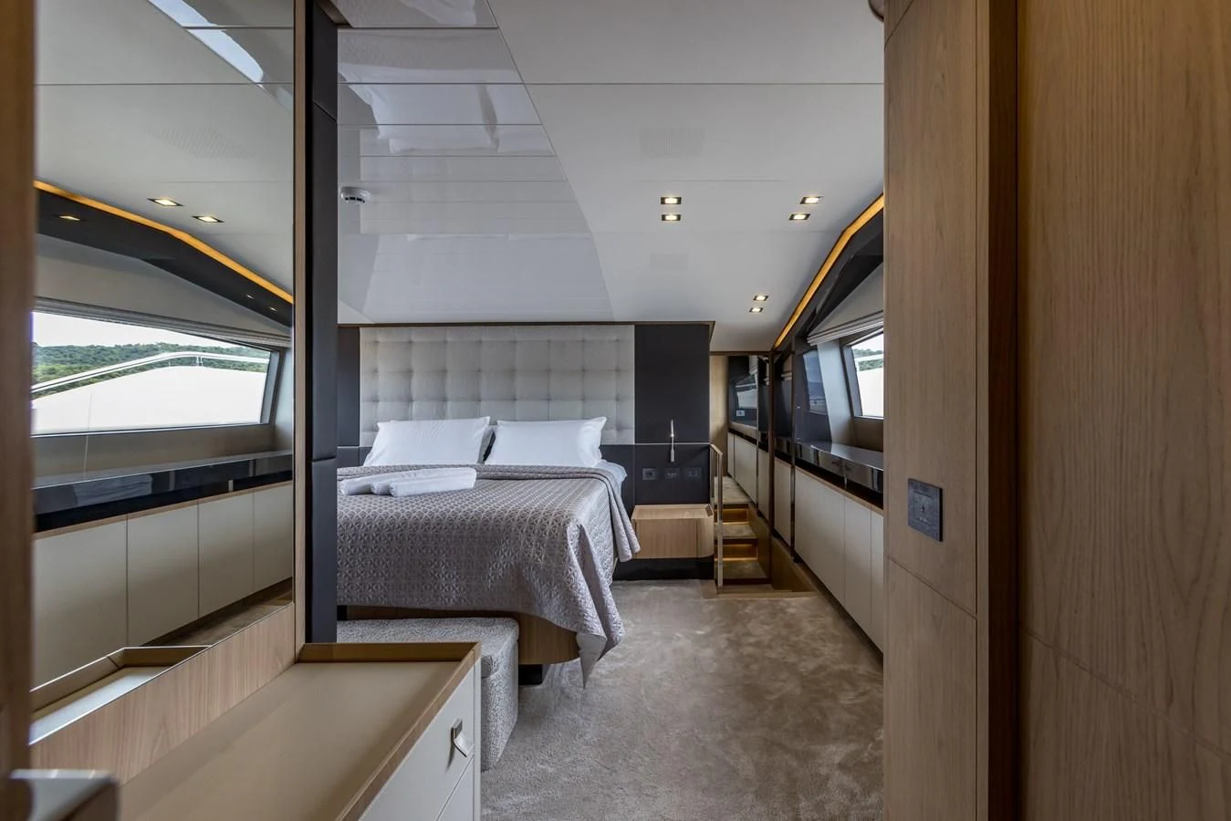 a room with a bed and a window aboard KATARIINA XO Yacht for Sale