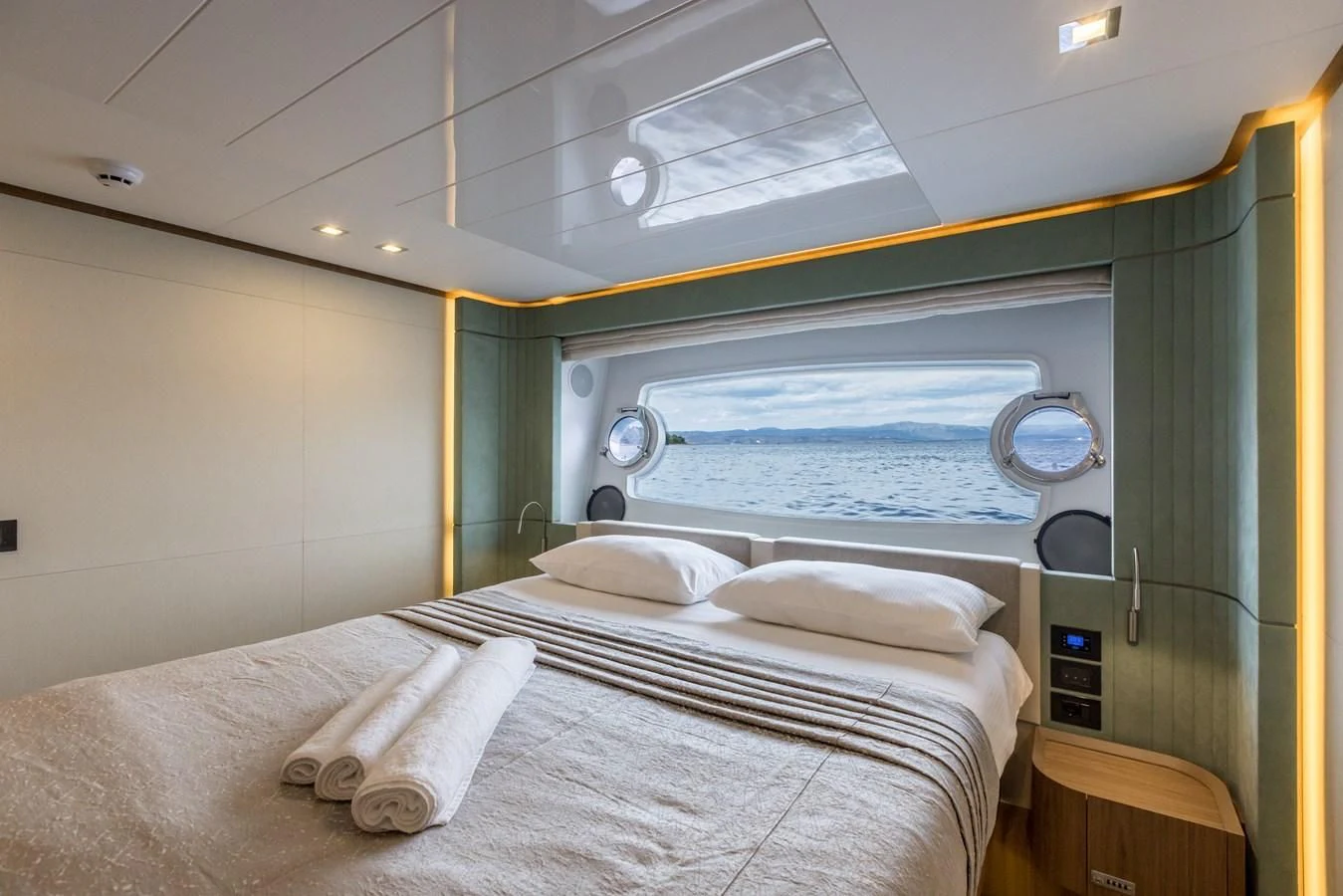 a room with a bed and a window aboard KATARIINA XO Yacht for Sale