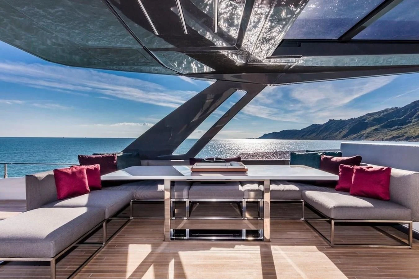 a room with a couch and a table and a view of the ocean aboard KATARIINA XO Yacht for Sale