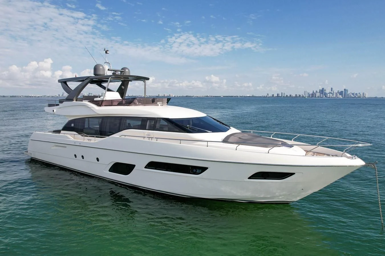 a white yacht in the water aboard KATARIINA XO Yacht for Sale