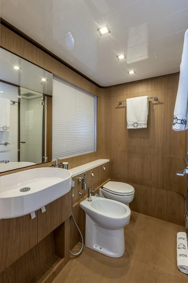a bathroom with a toilet and a sink aboard KATARIINA XO Yacht for Sale
