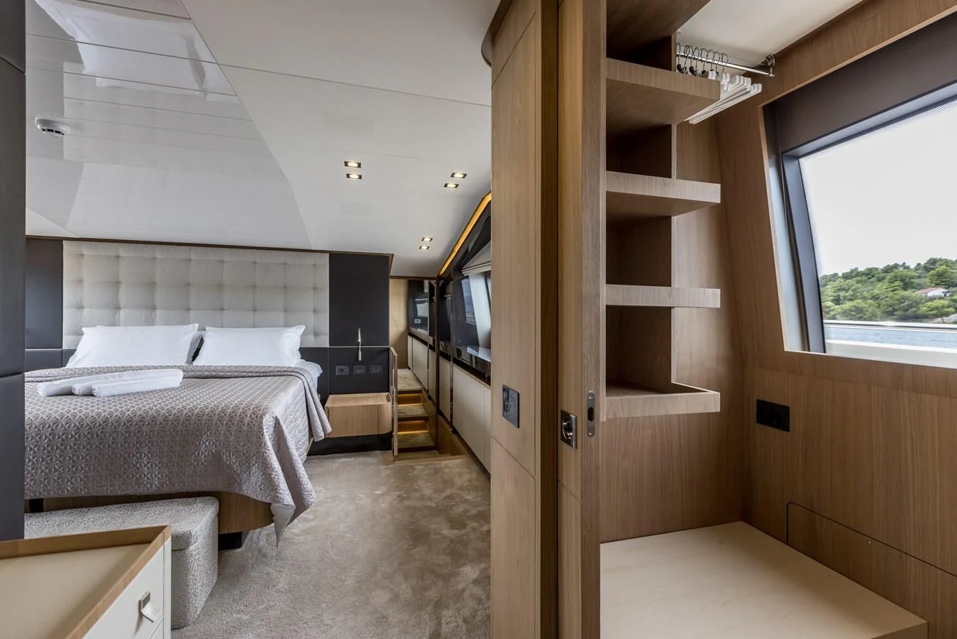 a room with a bed and a window aboard KATARIINA XO Yacht for Sale