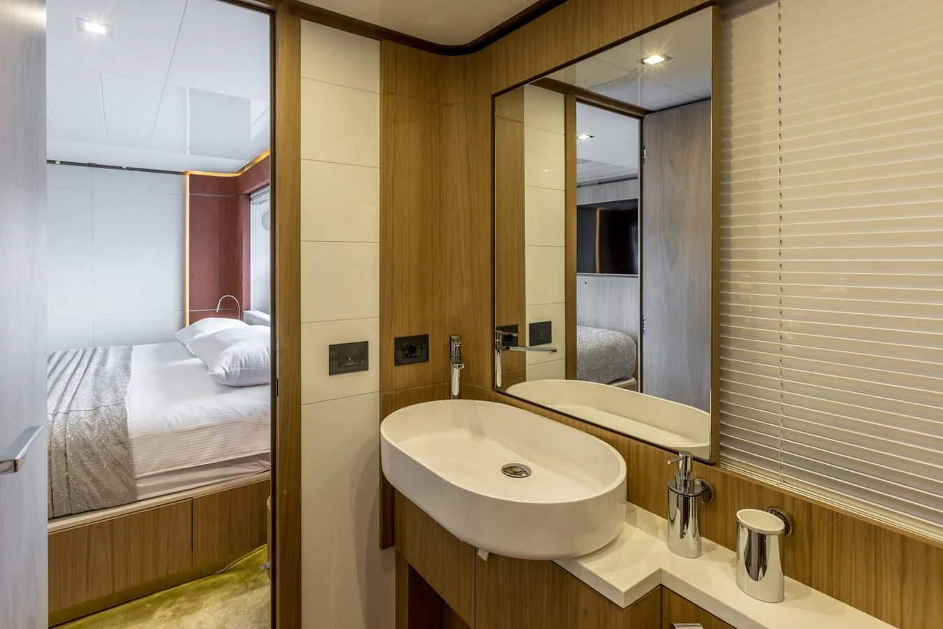 a bathroom with a sink and mirror aboard KATARIINA XO Yacht for Sale