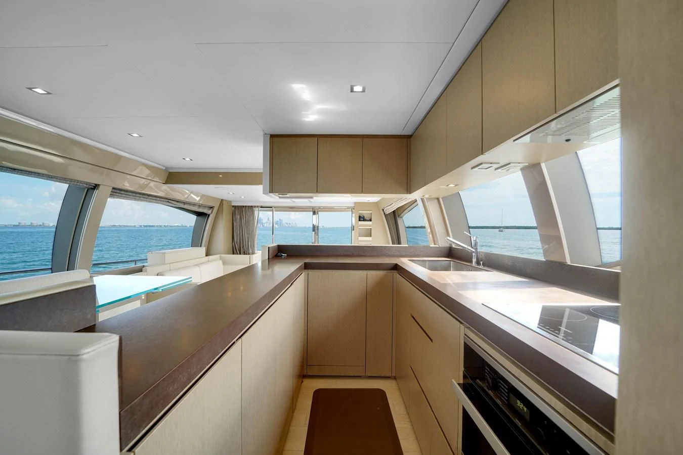 a kitchen with a large window aboard KATARIINA XO Yacht for Sale