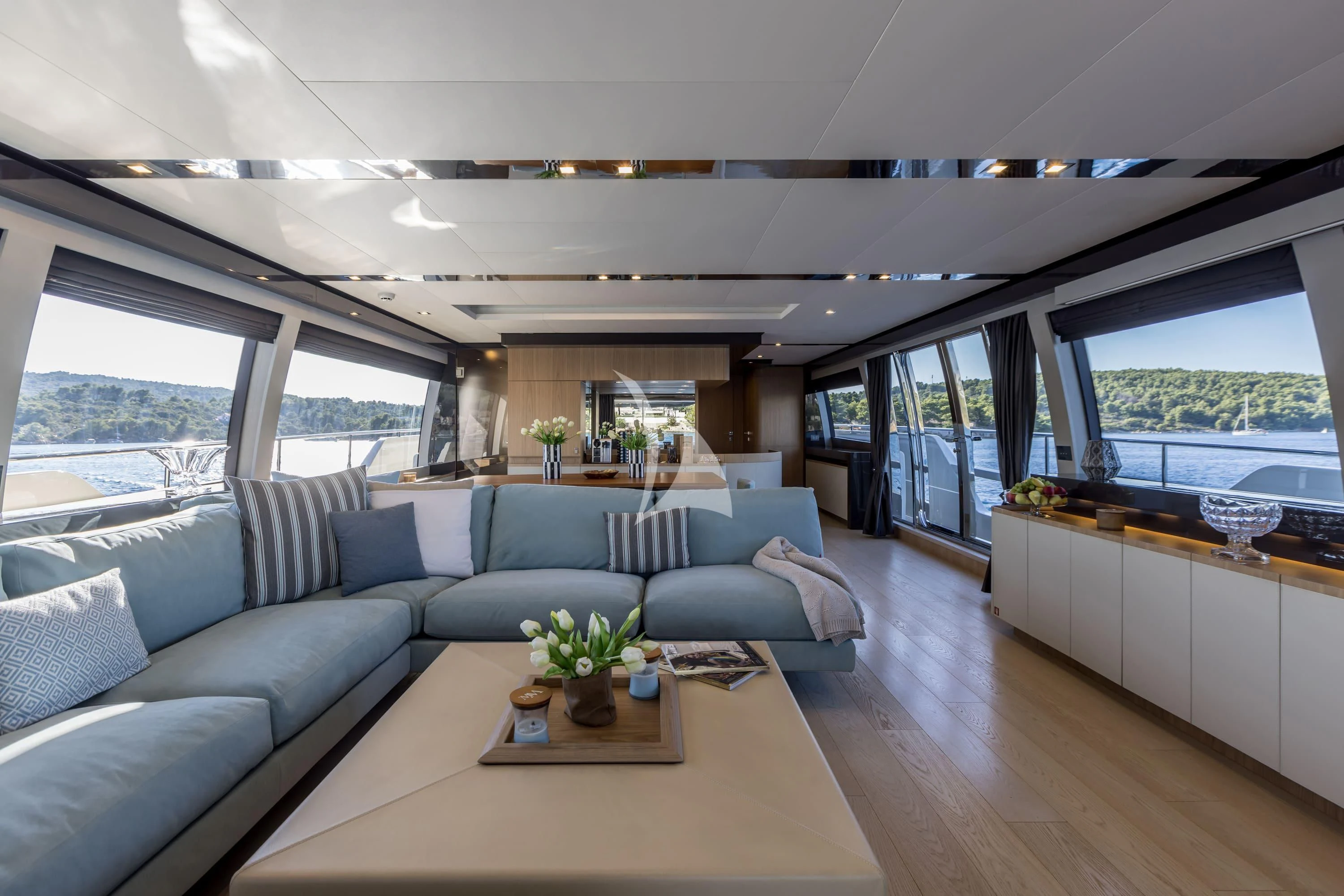 a living room with a large window aboard KATARIINA XO Yacht for Sale