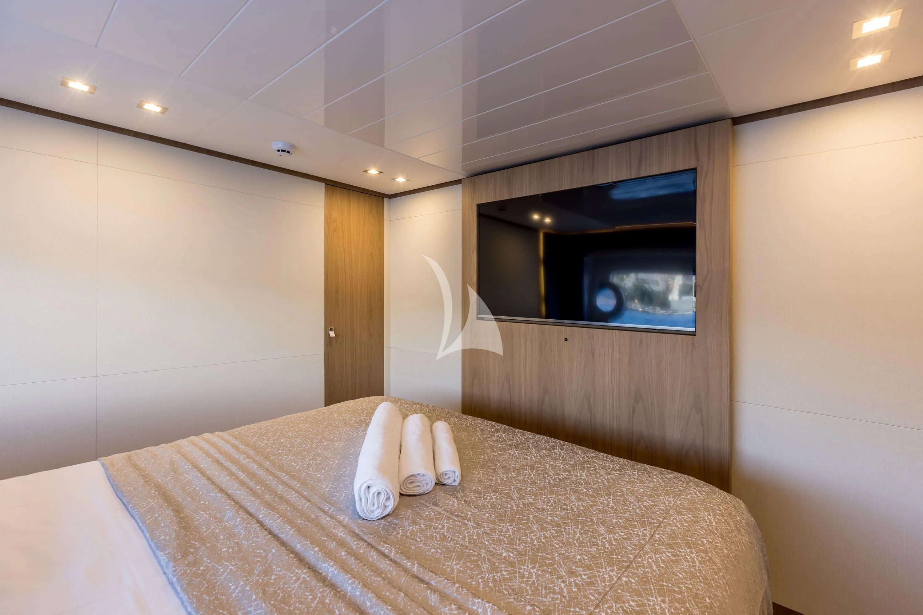 a bed with a large mirror above it aboard KATARIINA XO Yacht for Sale