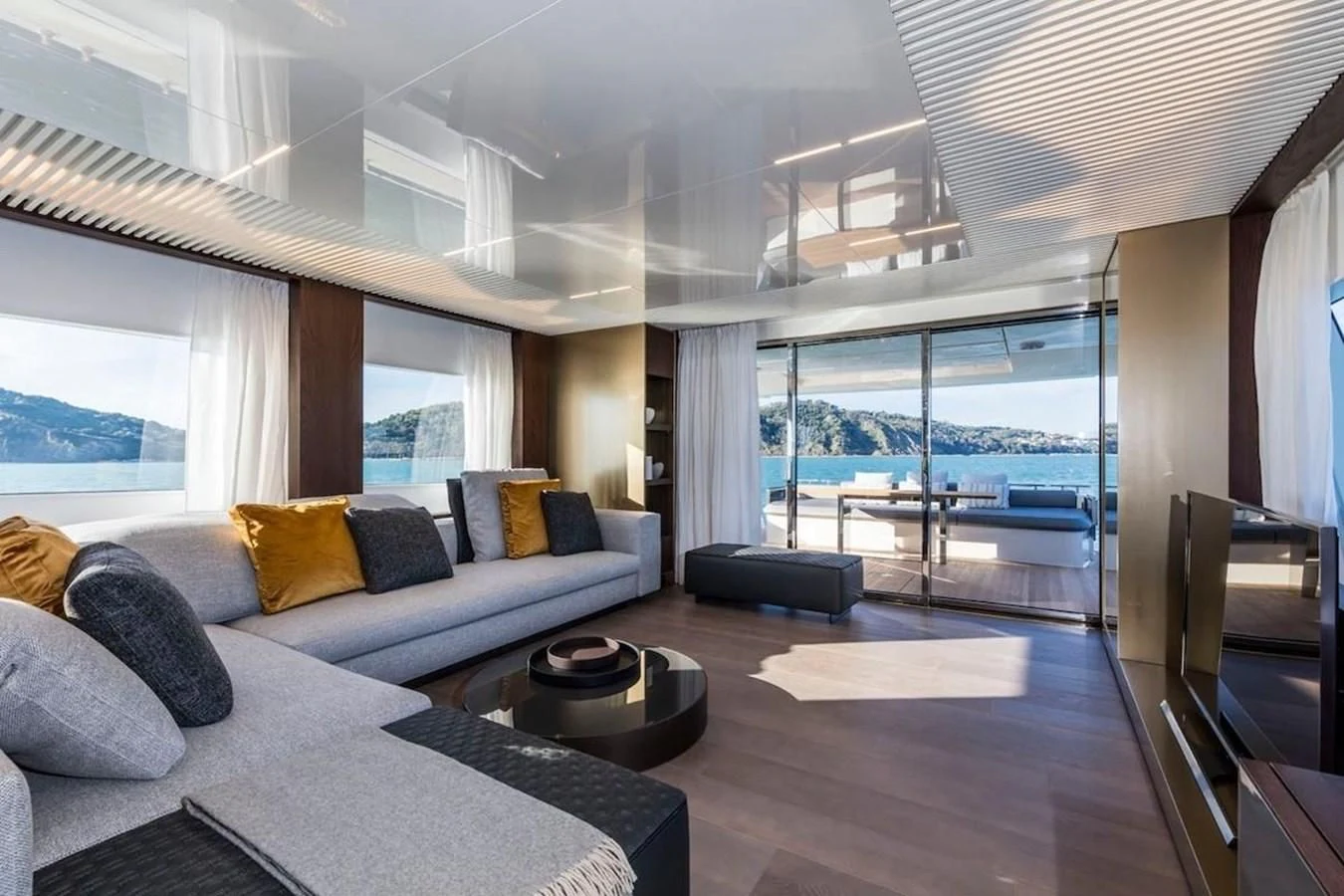 a large living room with a large window aboard KATARIINA XO Yacht for Sale