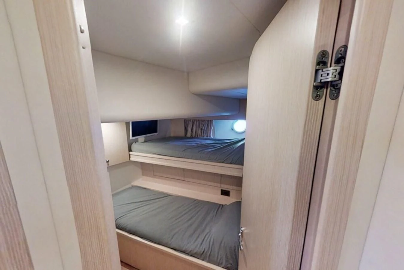 a room with a bed and a door aboard KATARIINA XO Yacht for Sale