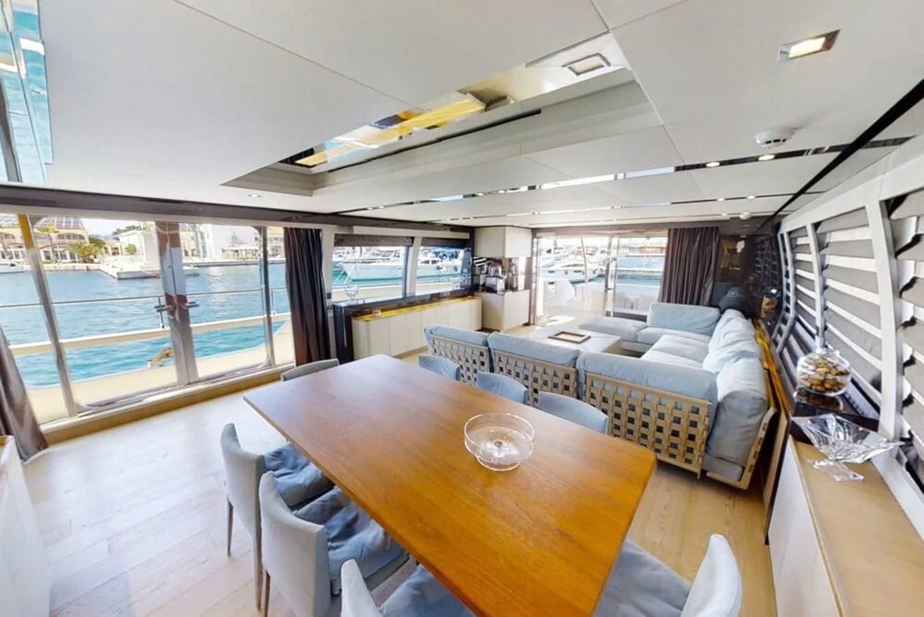 a room with a table and chairs aboard KATARIINA XO Yacht for Sale