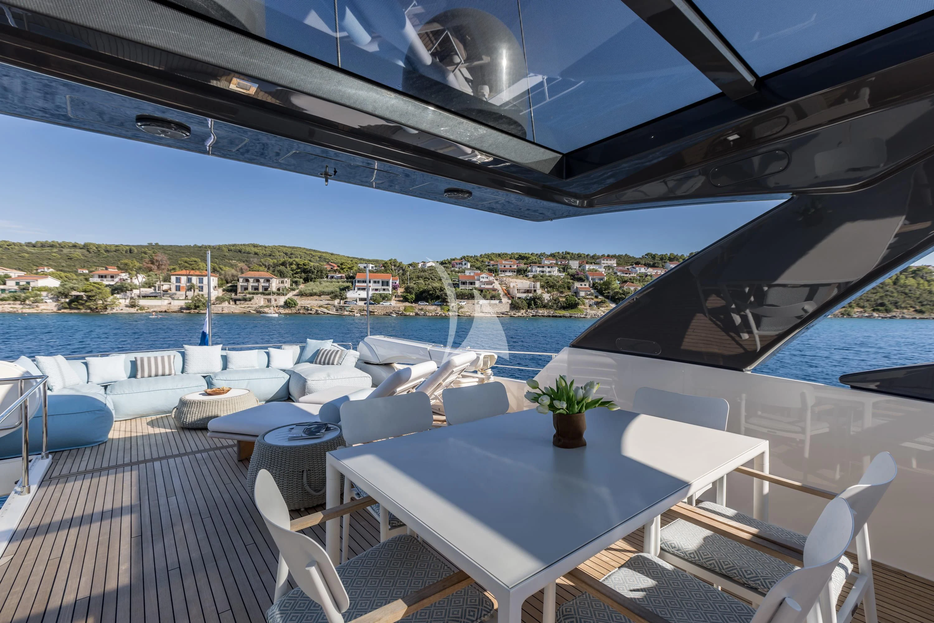 a patio with a table and chairs aboard KATARIINA XO Yacht for Sale