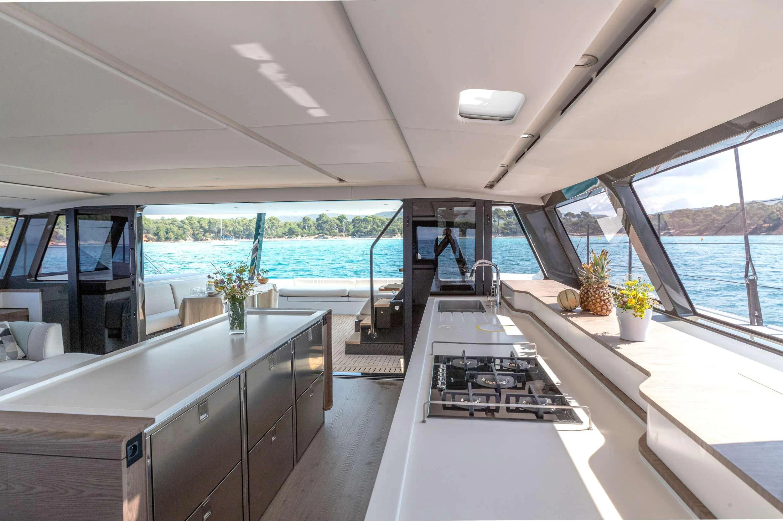 a kitchen with a large window aboard WONDERFUL Yacht for Charter