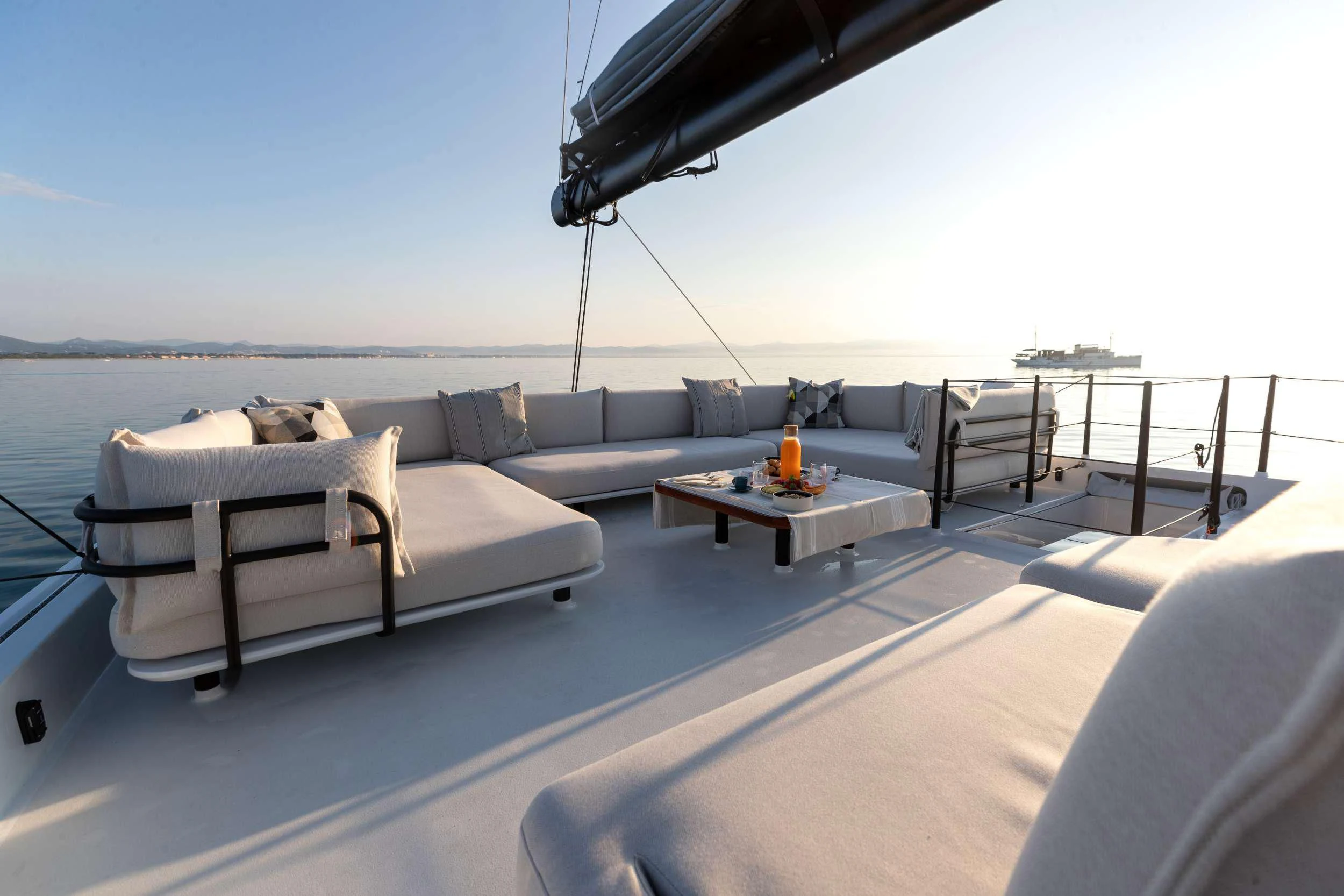 a living room with a couch and a table aboard WONDERFUL Yacht for Charter