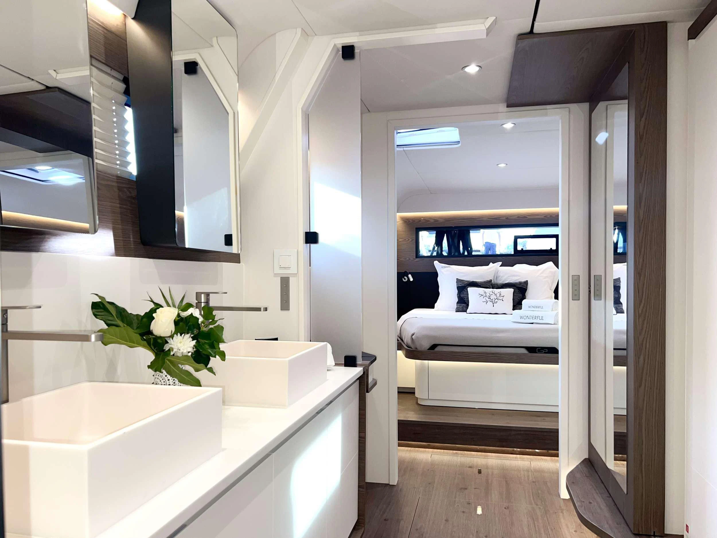 a room with a bed and a sink aboard WONDERFUL Yacht for Charter