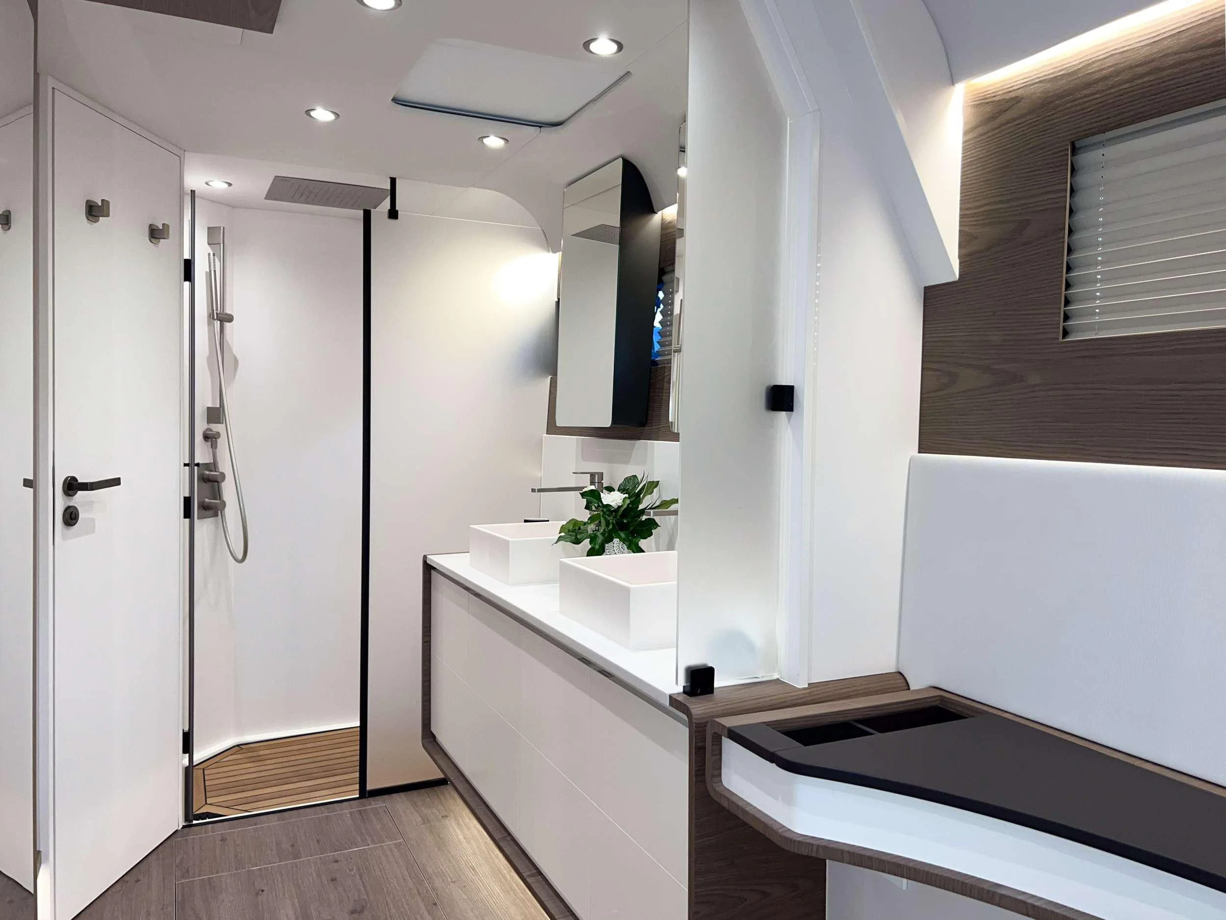 a modern bathroom with white cabinets aboard WONDERFUL Yacht for Charter