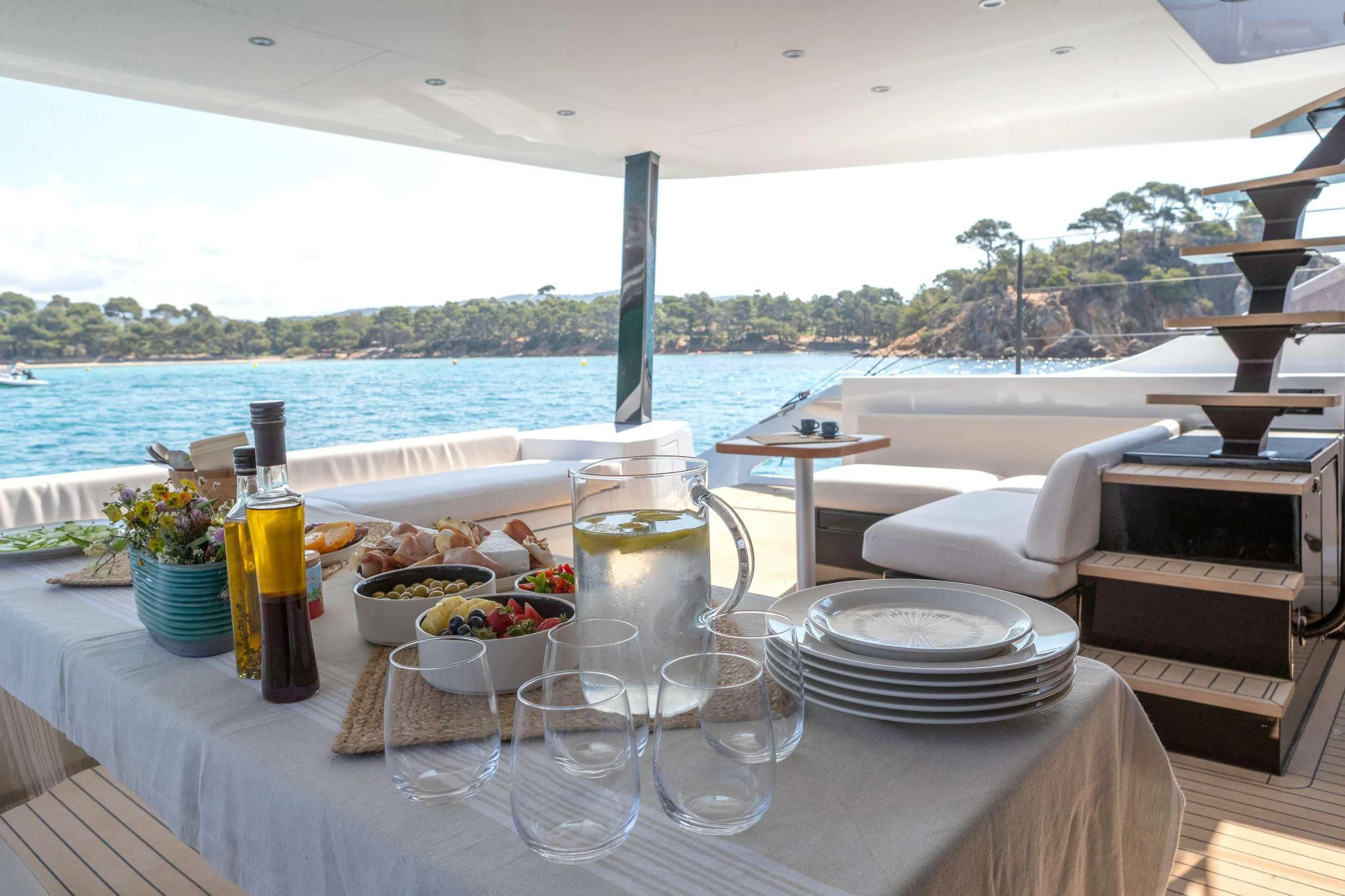 a table with food and drinks on it aboard WONDERFUL Yacht for Charter