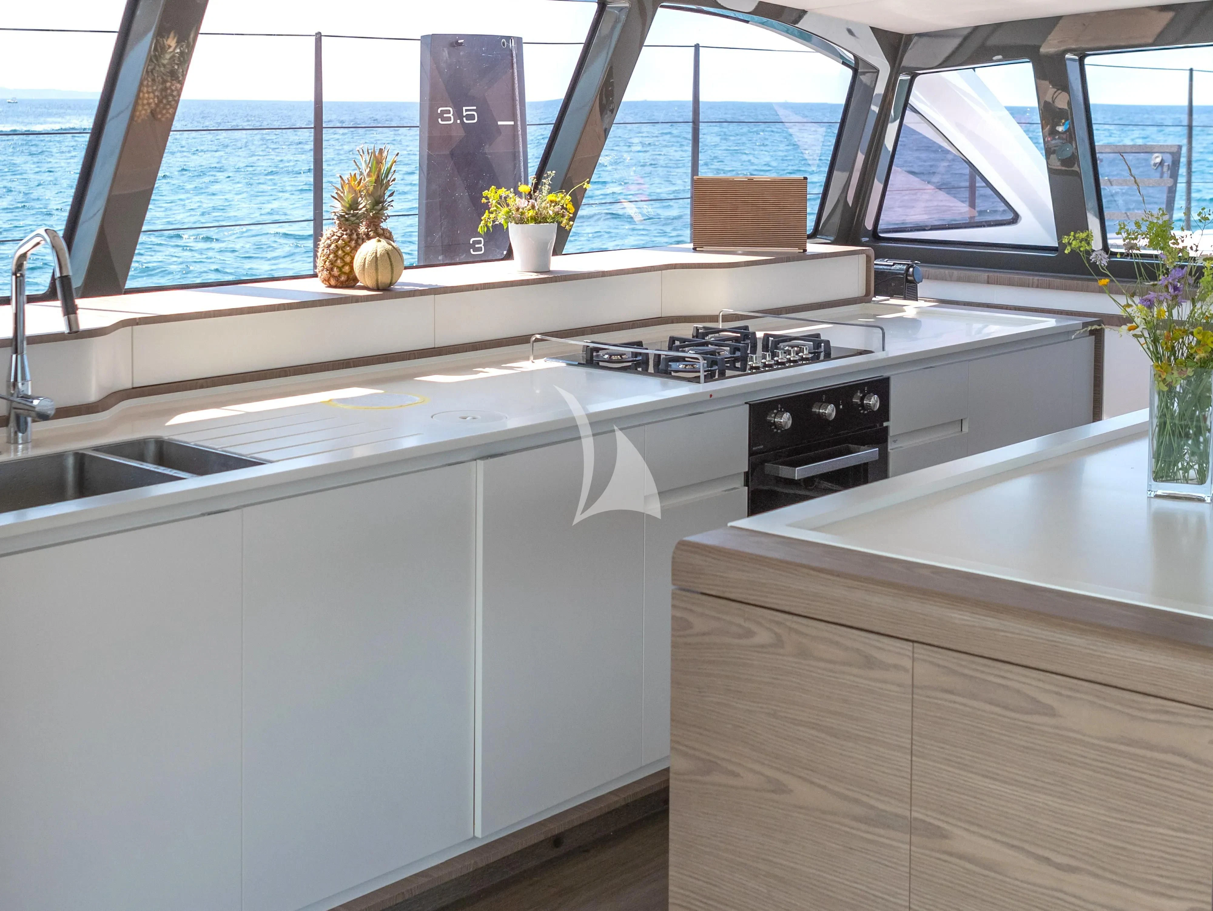 a kitchen with a window aboard WONDERFUL Yacht for Charter