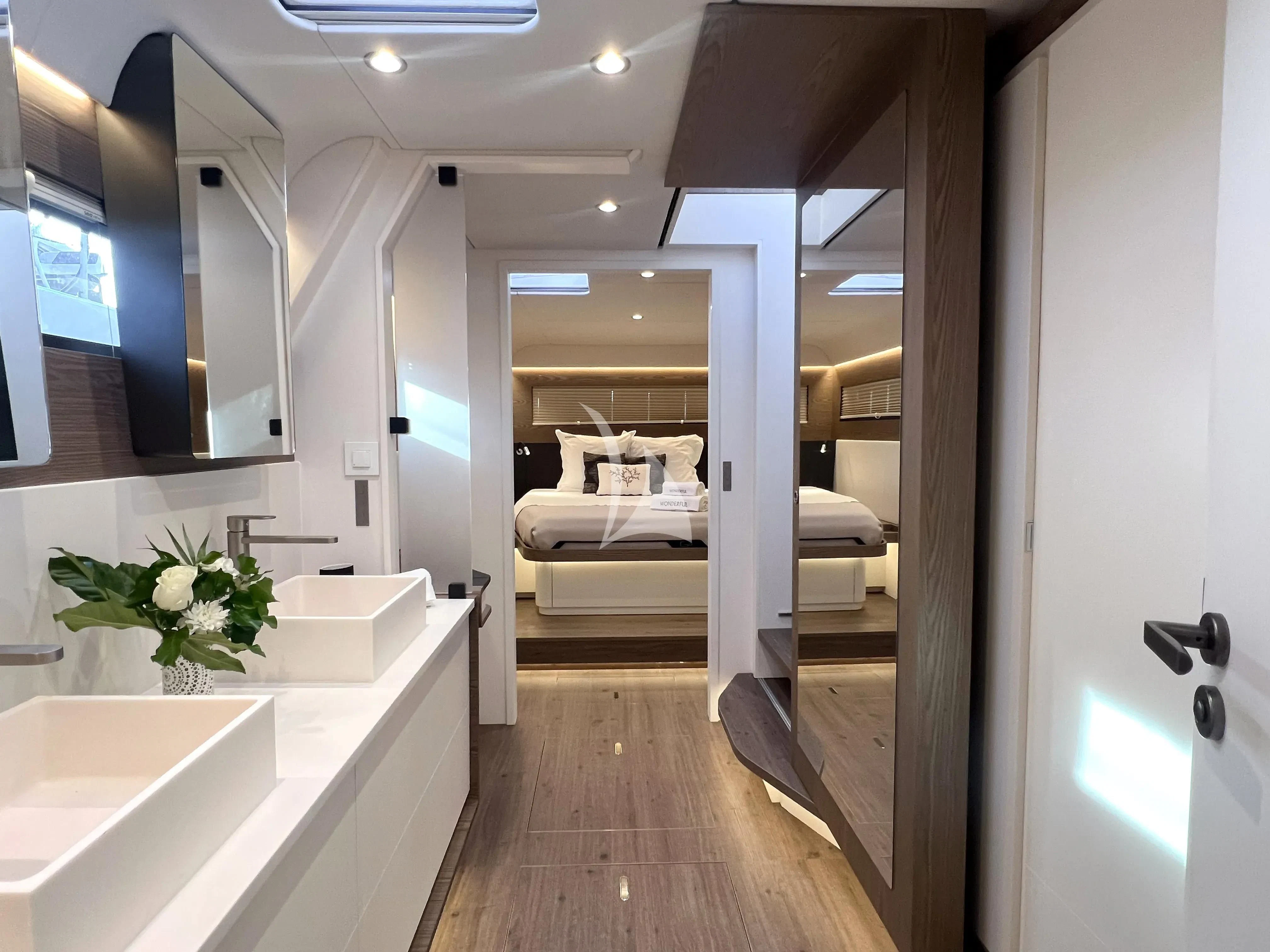 a bathroom with a sink and a bed aboard WONDERFUL Yacht for Charter