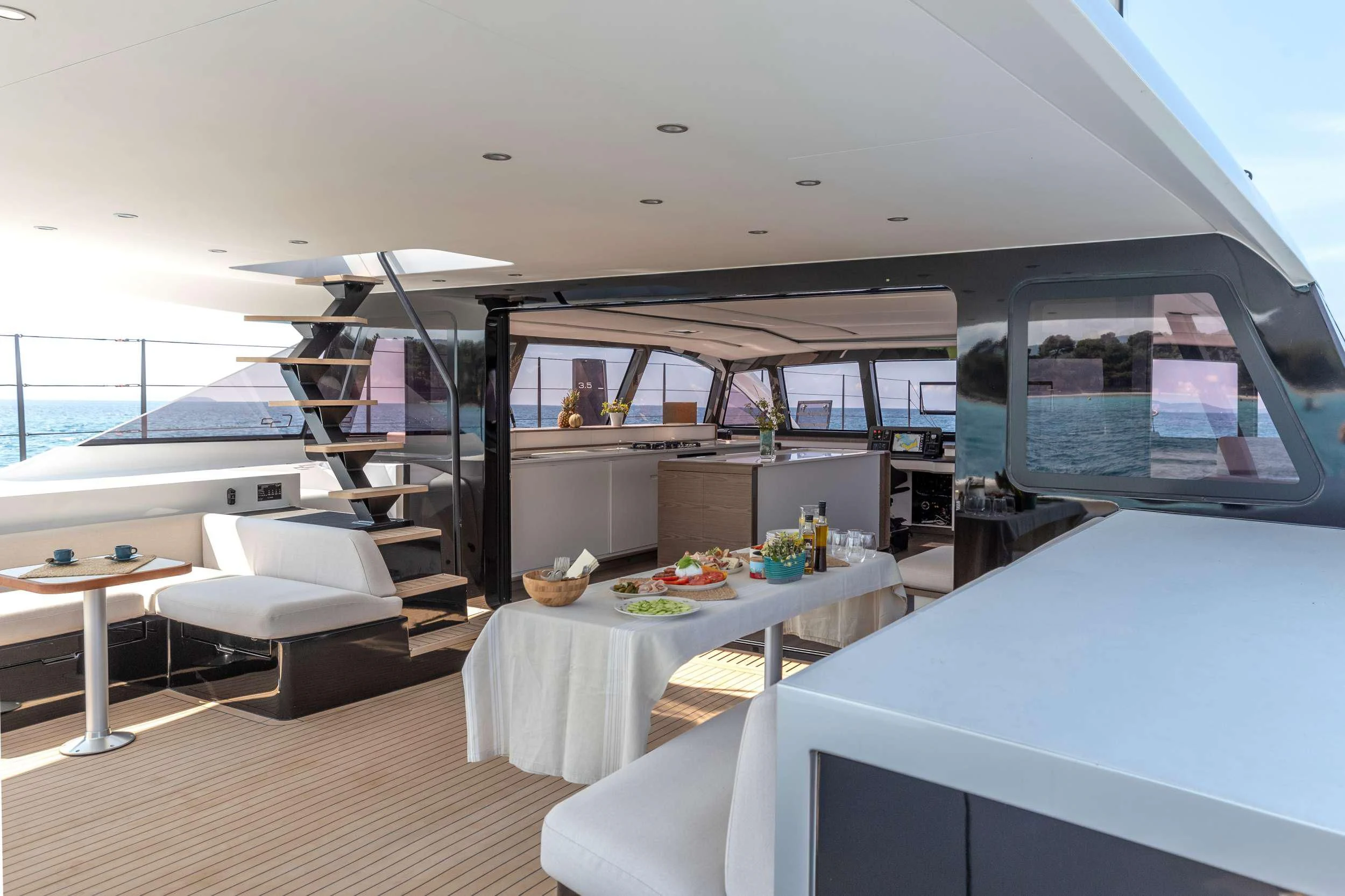 a room with a table and a bed aboard WONDERFUL Yacht for Charter