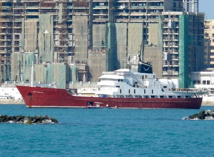 a large red boat in the water aboard BART ROBERTS Yacht for Sale