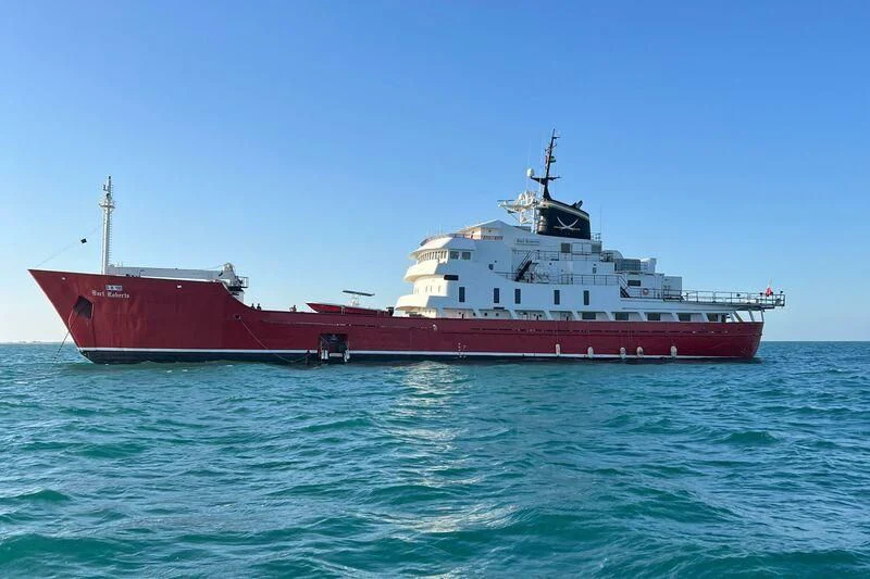 a red and white ship in the water aboard BART ROBERTS Yacht for Sale