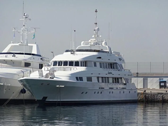 a couple of large white boats aboard INSPIRATION Yacht for Sale