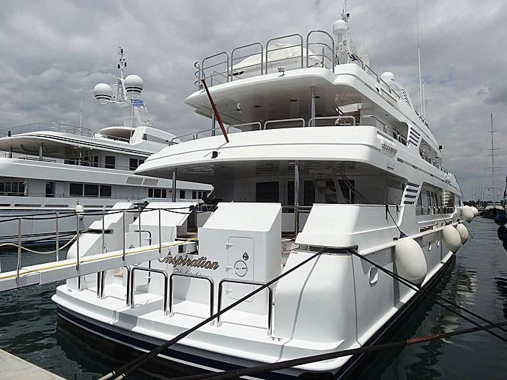a large white boat docked aboard INSPIRATION Yacht for Sale