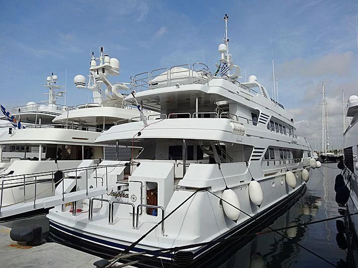 a large white boat aboard INSPIRATION Yacht for Sale