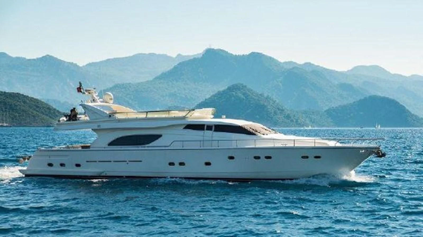 a white yacht on the water aboard 2000 FERRETTI  80 Yacht for Sale