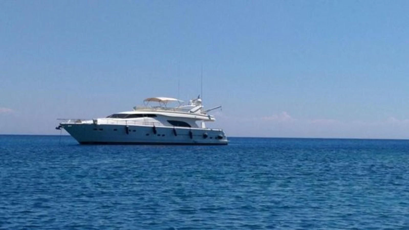 a boat in the water aboard 2000 FERRETTI  80 Yacht for Sale