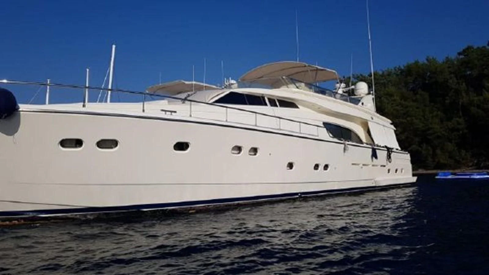 a white yacht on the water aboard 2000 FERRETTI  80 Yacht for Sale