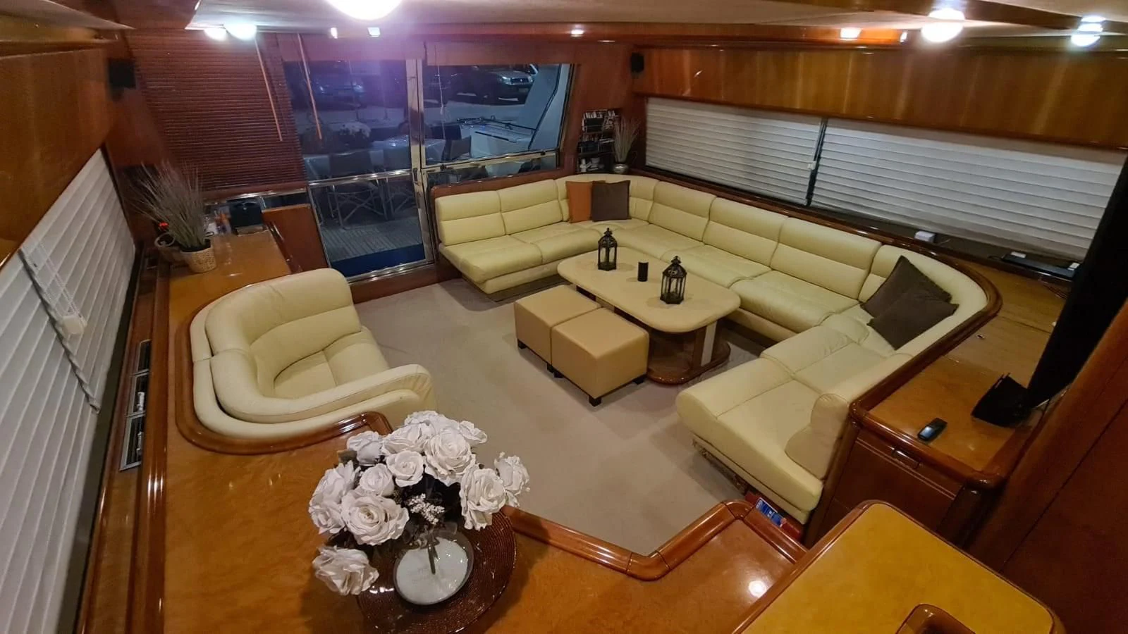 a room with a couch and a table aboard 2000 FERRETTI  80 Yacht for Sale