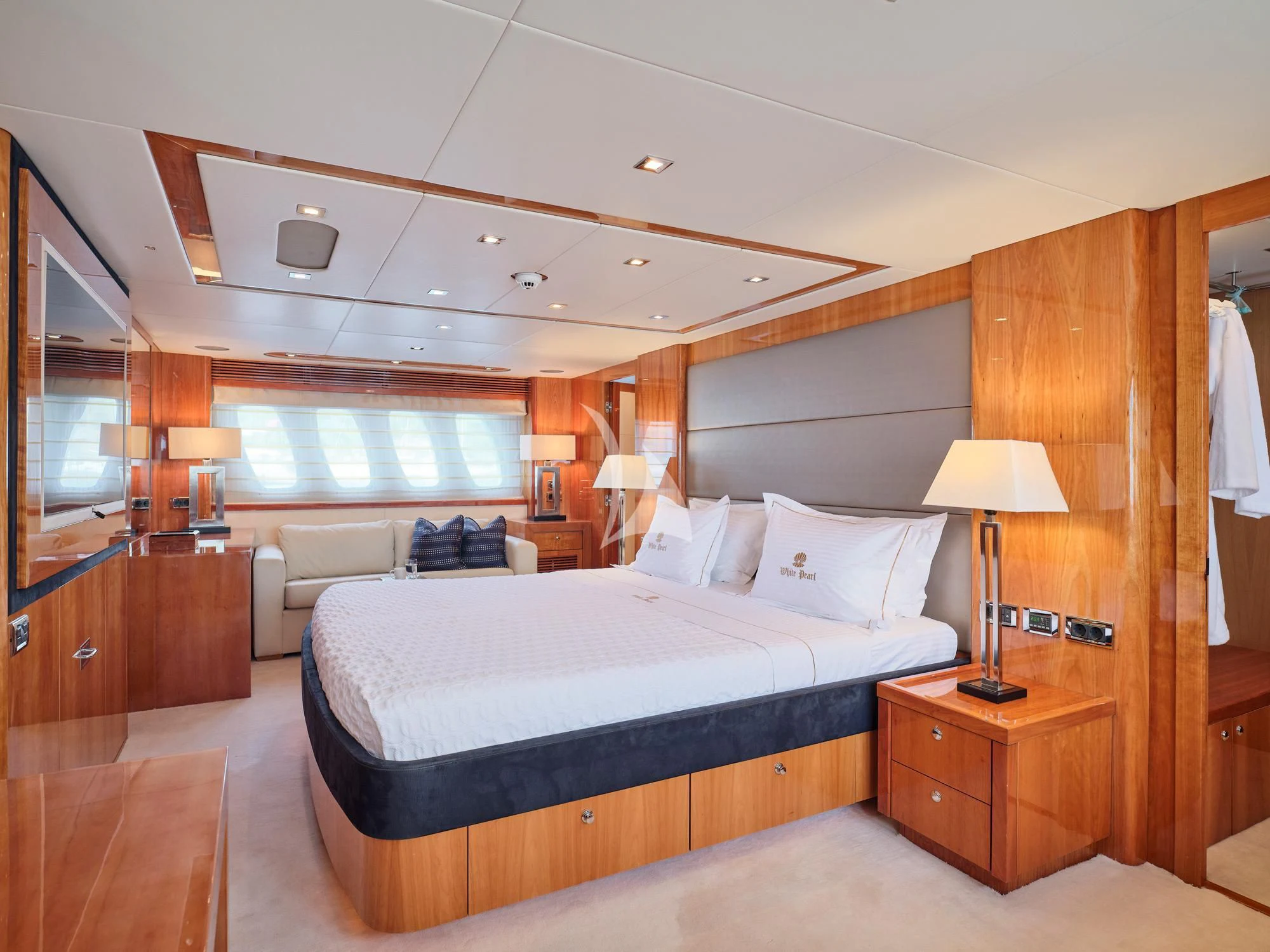 a bedroom with a bed and a desk aboard WHITE PEARL I Yacht for Sale