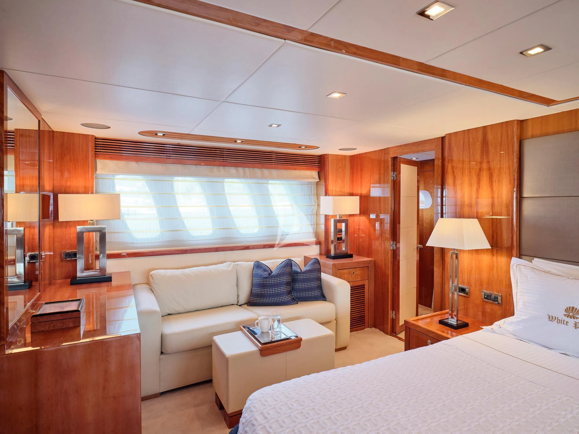 a hotel room with a bed and a couch aboard WHITE PEARL I Yacht for Sale
