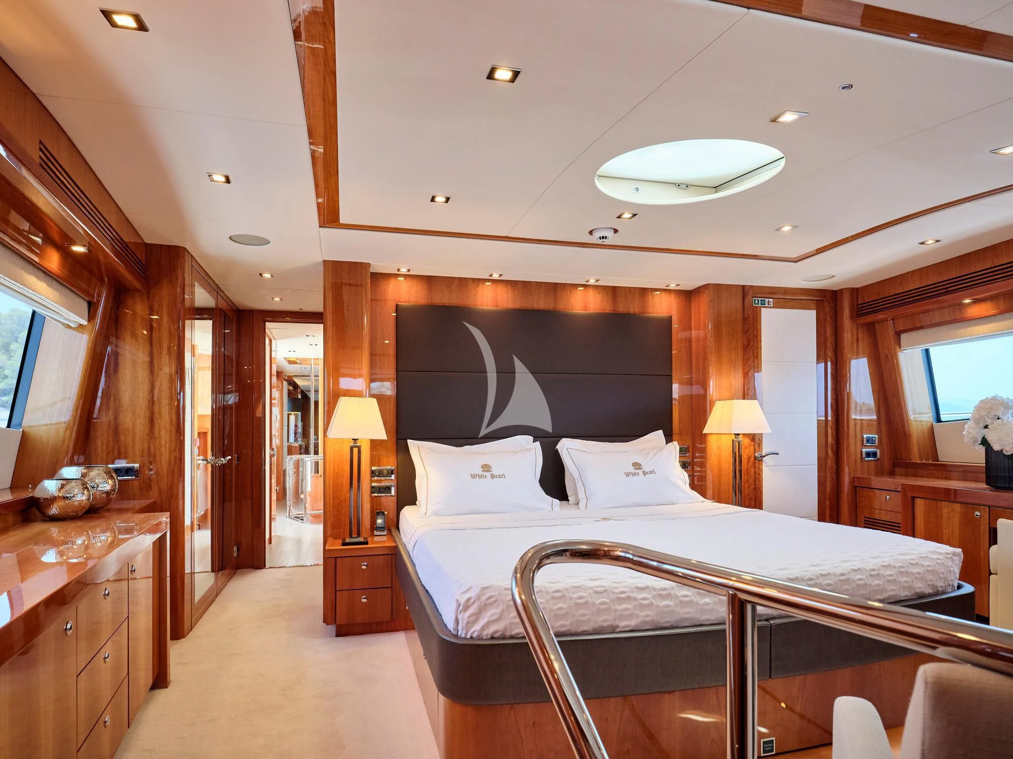 a large bedroom with a large bed aboard WHITE PEARL I Yacht for Sale