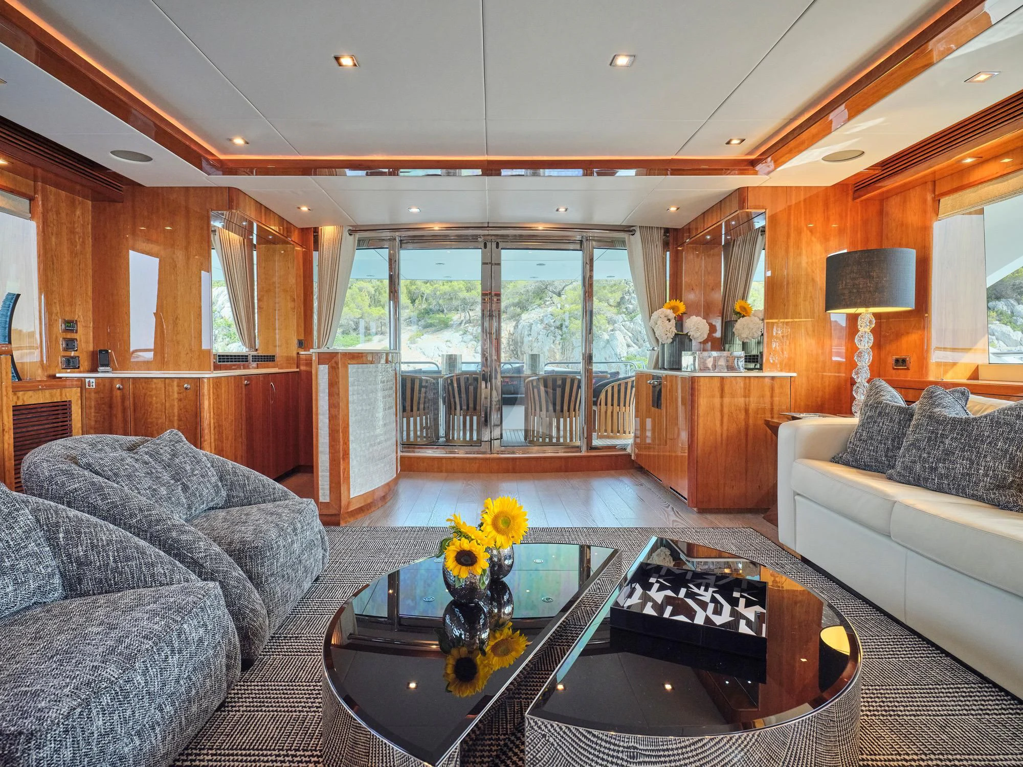 a living room with a large glass window aboard WHITE PEARL I Yacht for Sale