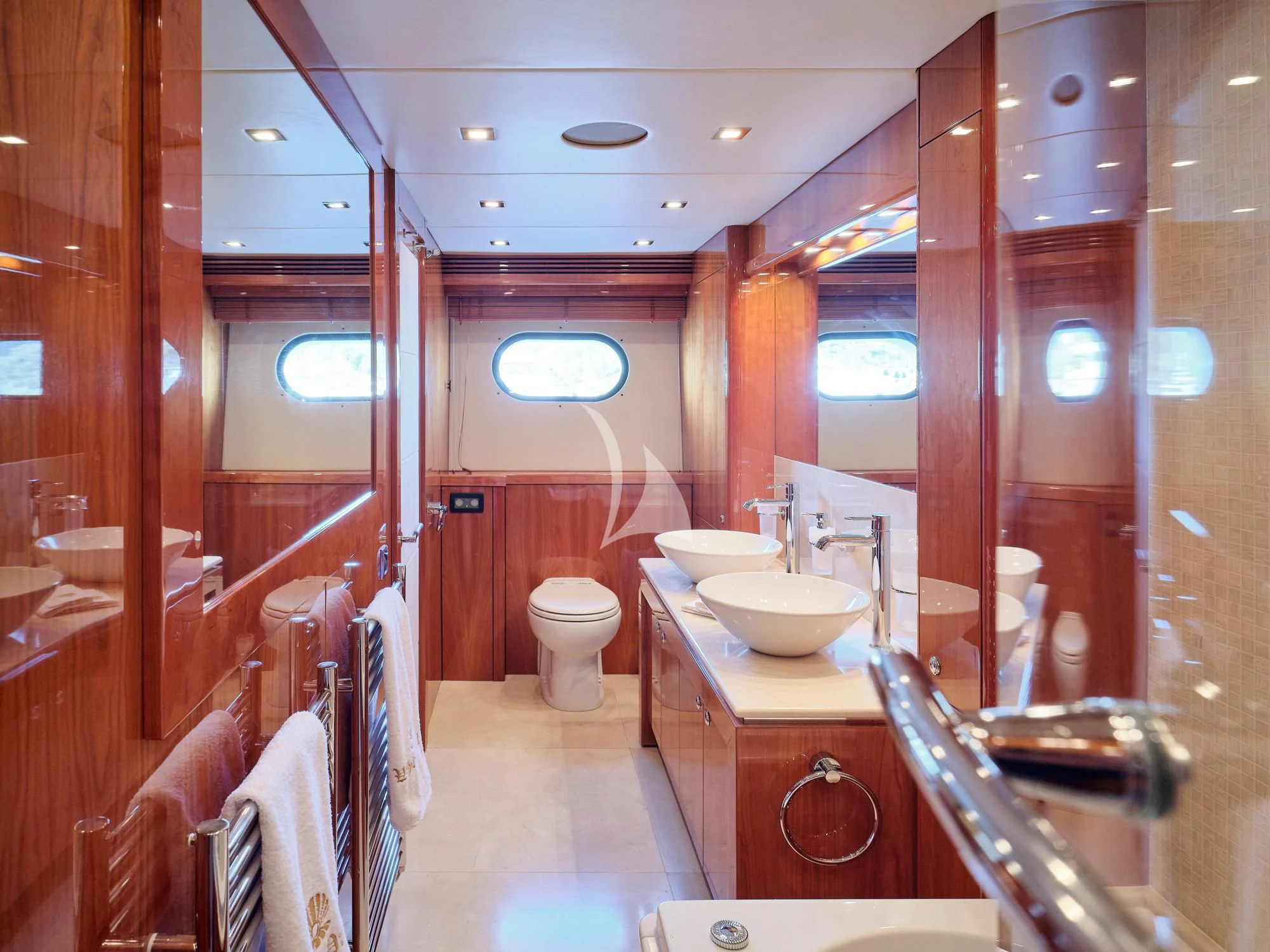 a bathroom with a sink and toilet aboard WHITE PEARL I Yacht for Sale
