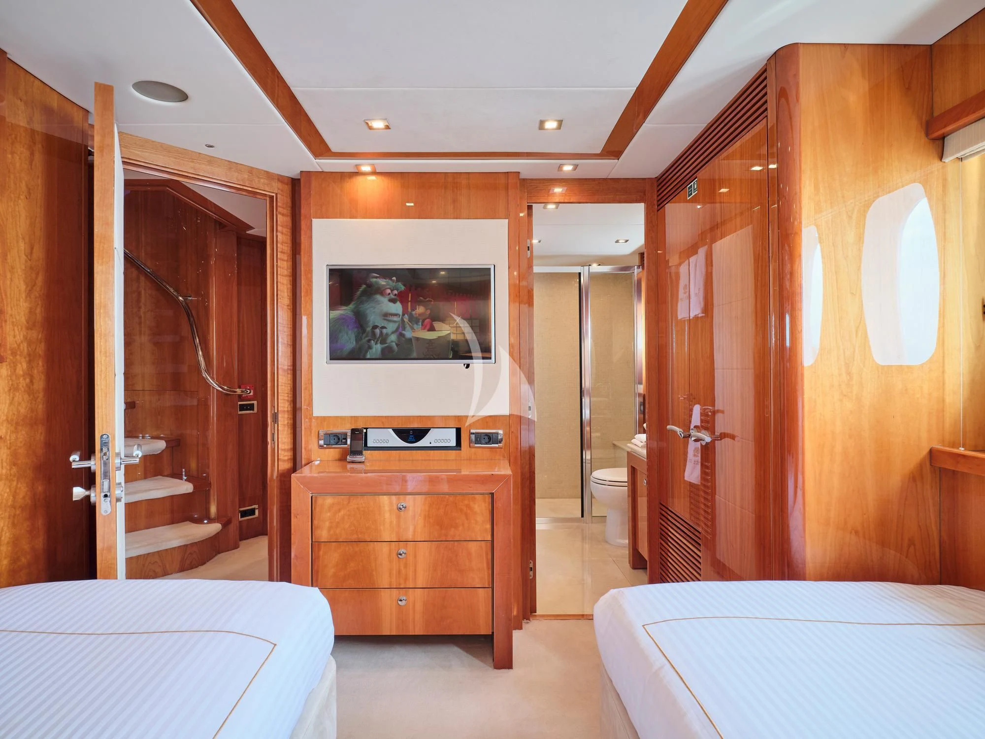 a bedroom with a bed and a mirror aboard WHITE PEARL I Yacht for Sale