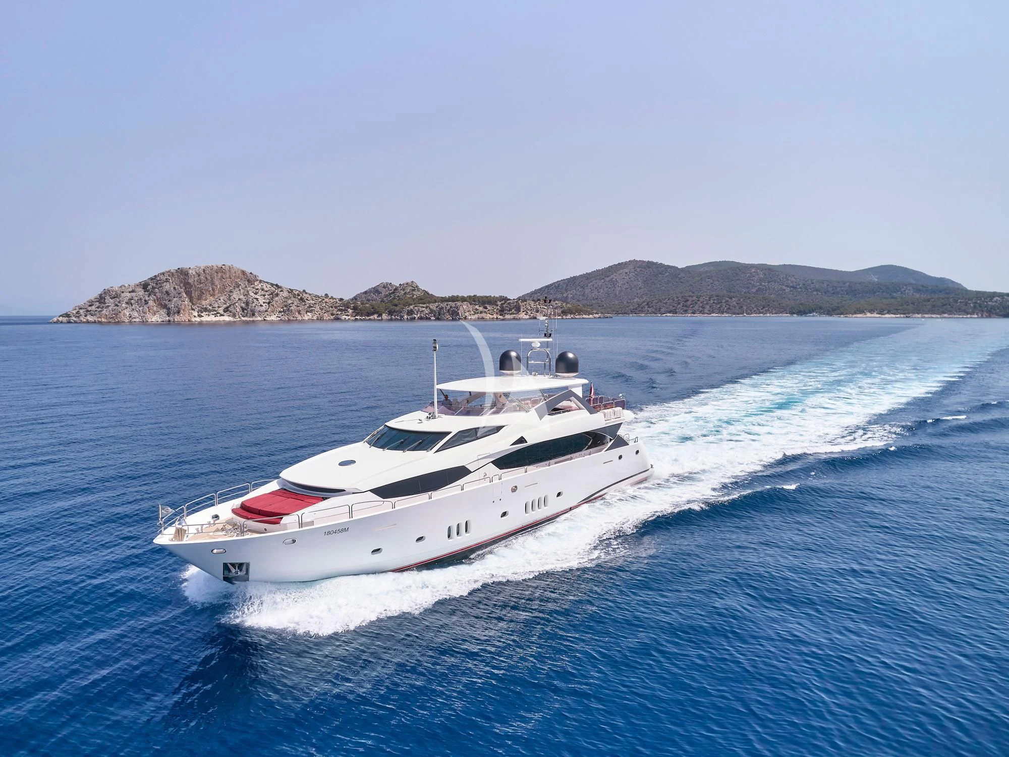 a white yacht on the water aboard WHITE PEARL I Yacht for Sale