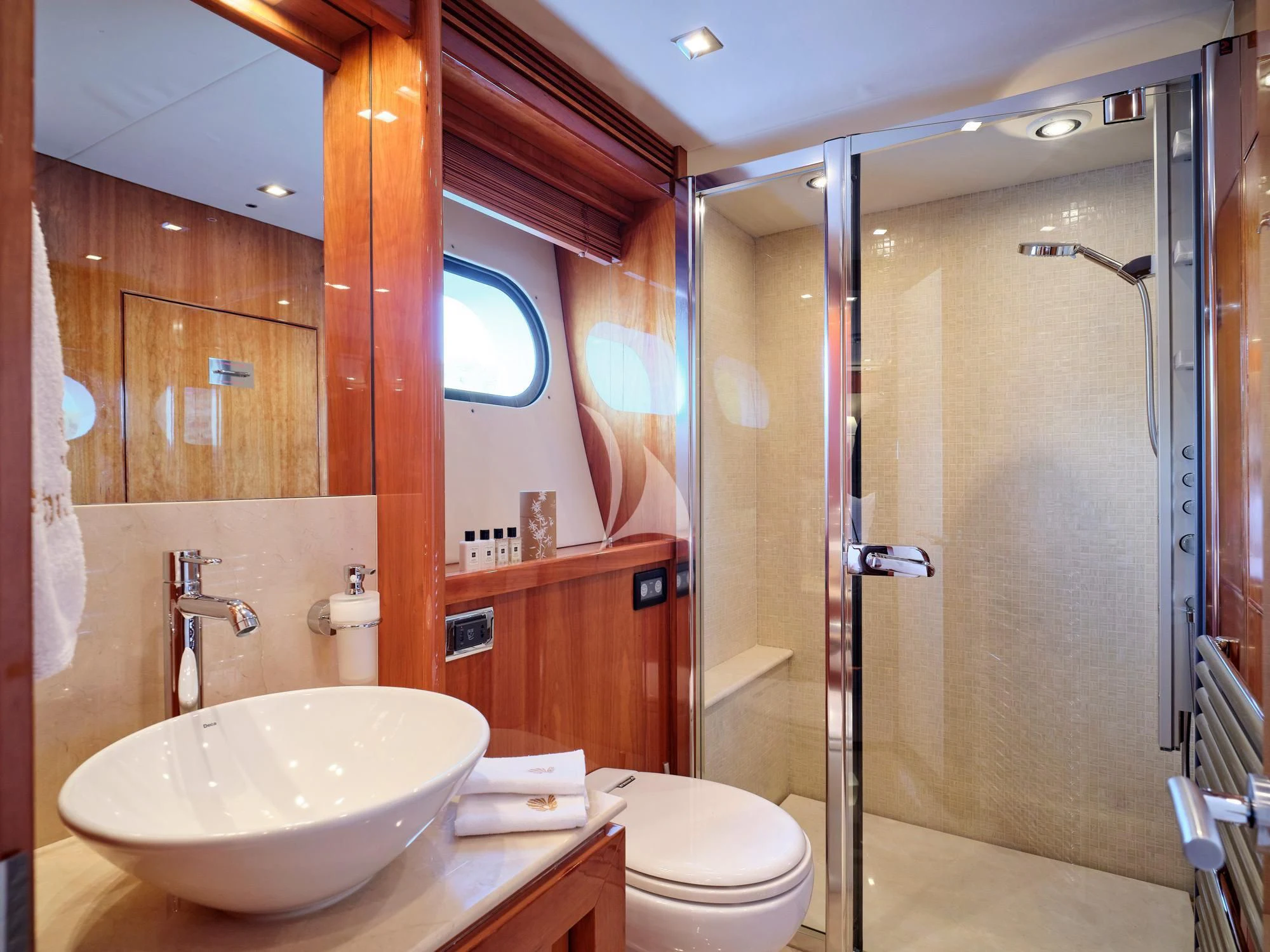 a bathroom with a sink and a shower aboard WHITE PEARL I Yacht for Sale