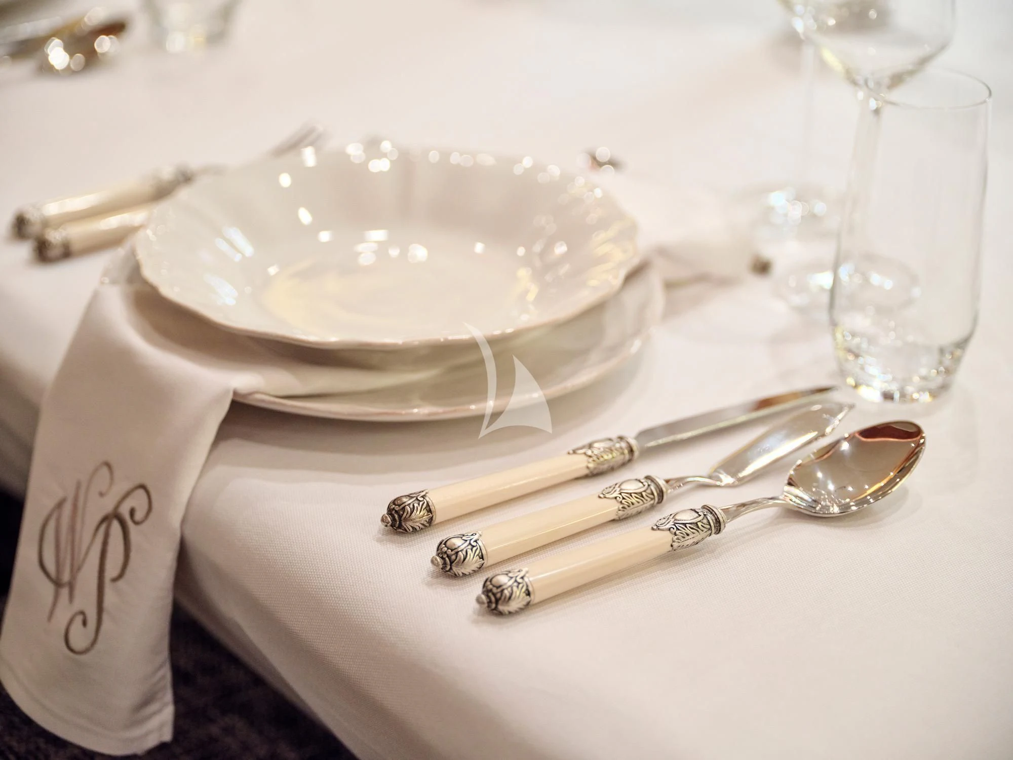 a plate with a cake and a spoon on it aboard WHITE PEARL I Yacht for Sale
