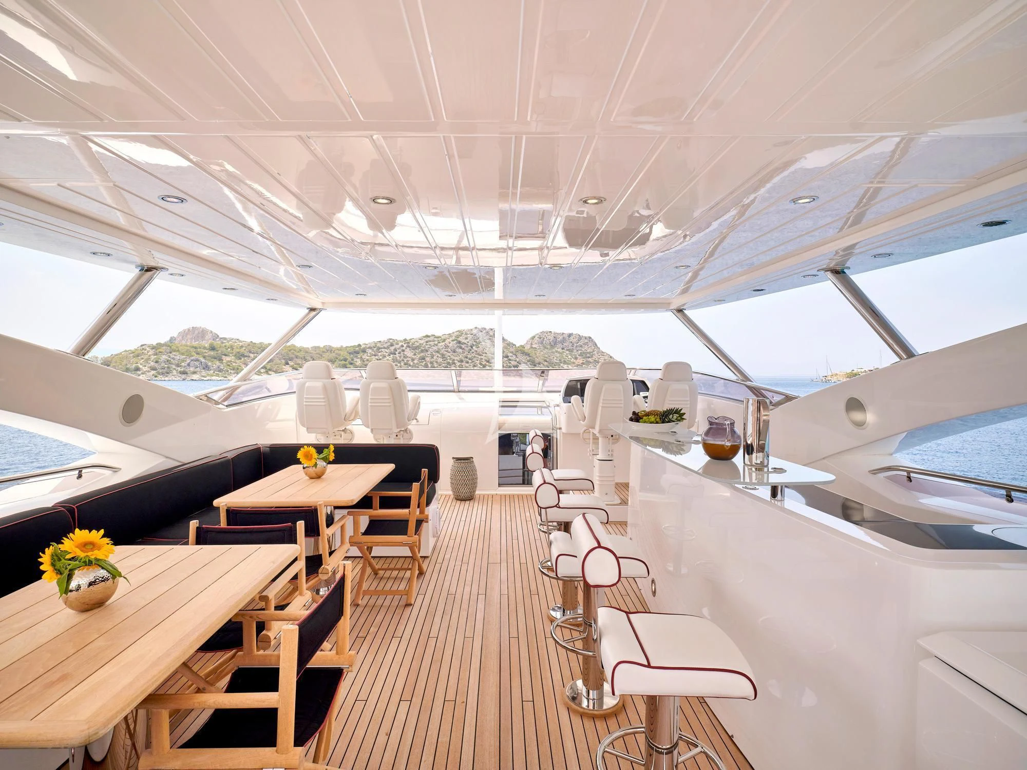 a large room with tables and chairs aboard WHITE PEARL I Yacht for Sale