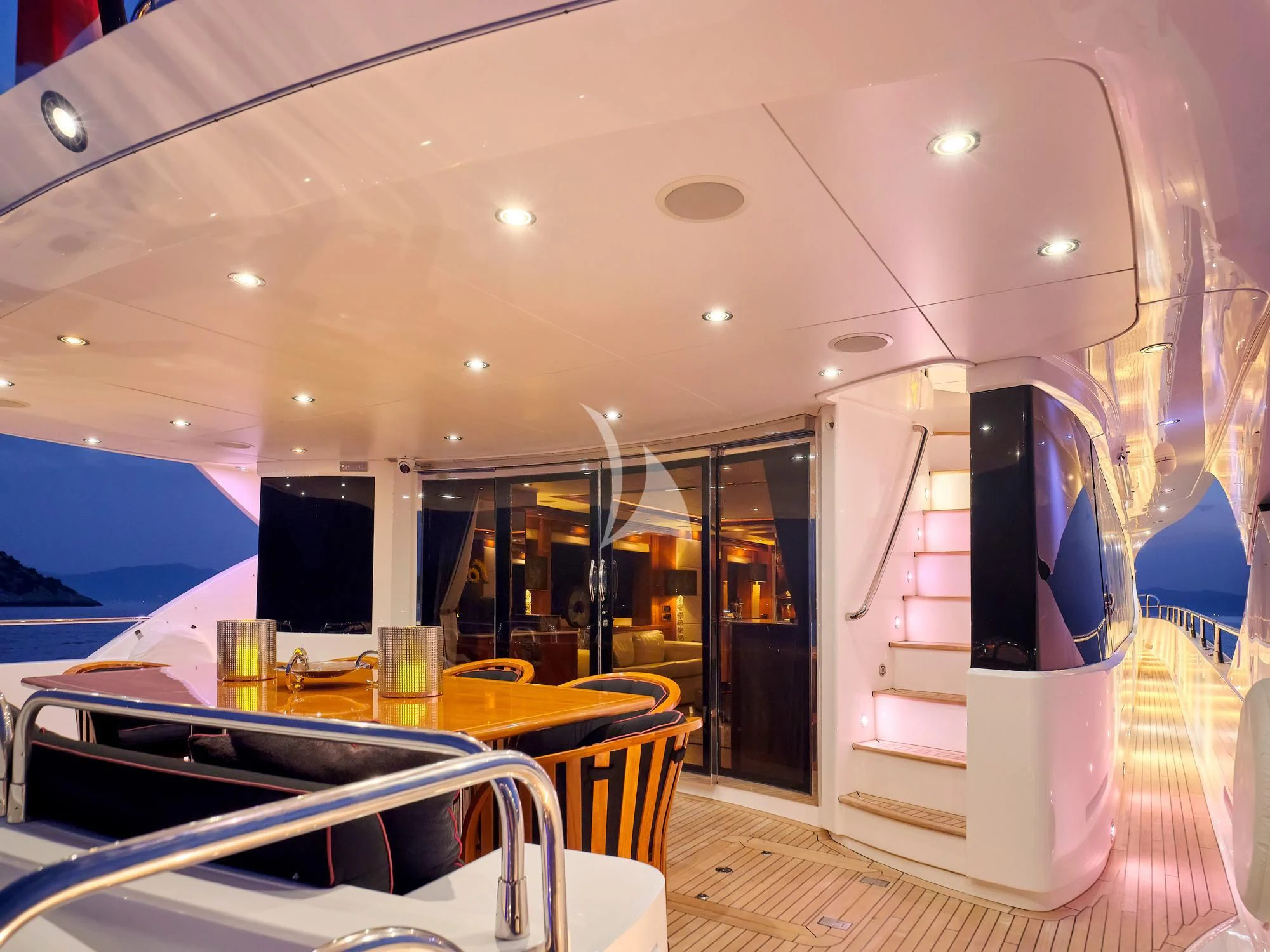 a room with a table and chairs aboard WHITE PEARL I Yacht for Sale