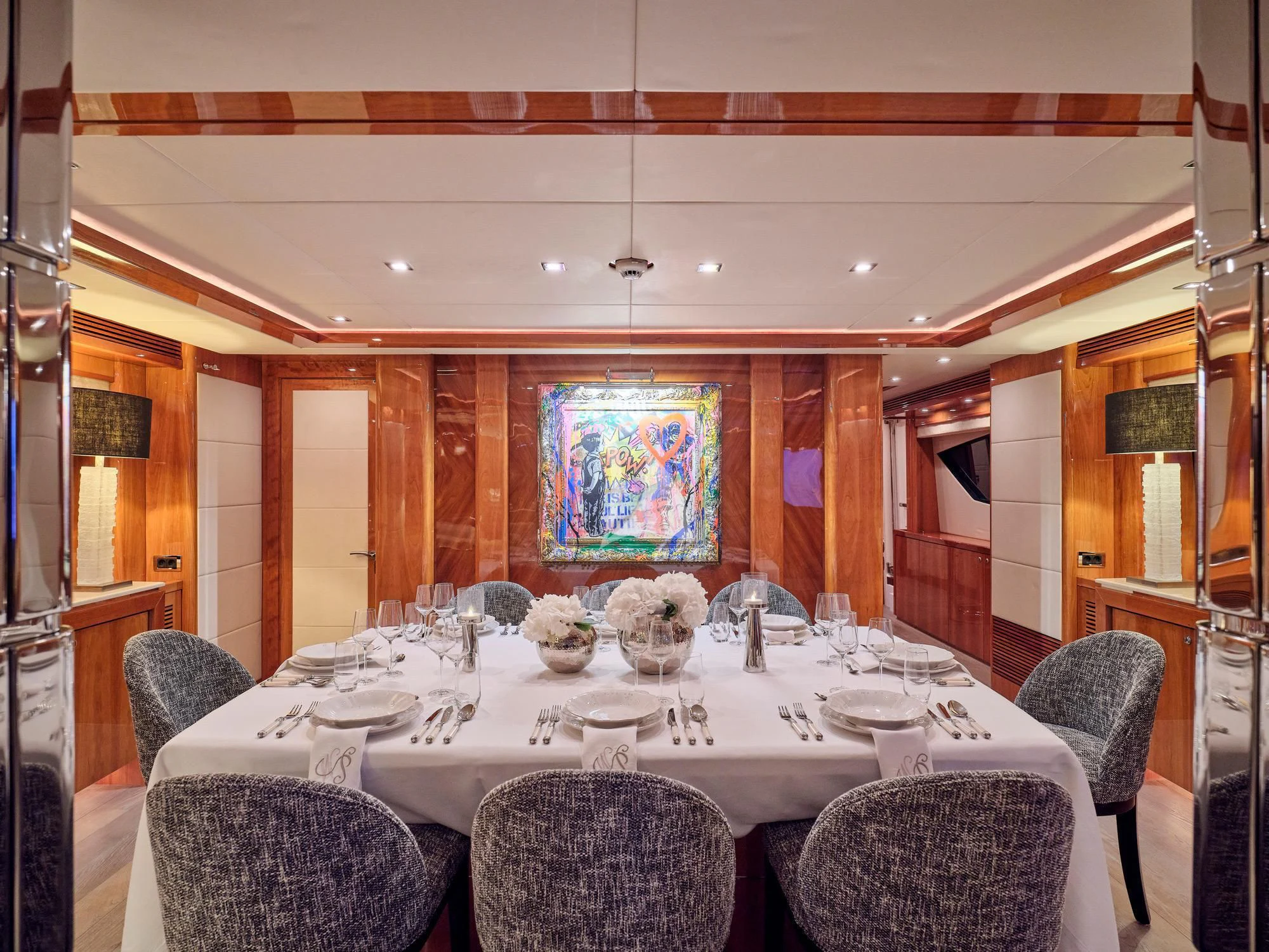 a dining room with a table set aboard WHITE PEARL I Yacht for Sale