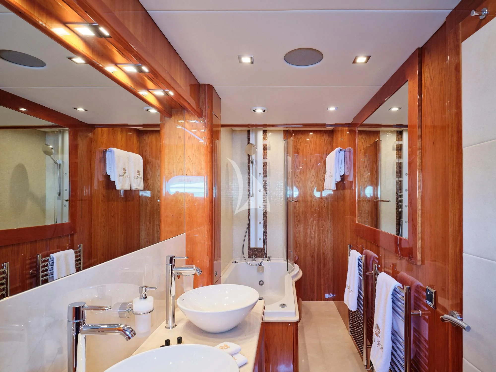 a bathroom with a sink and a mirror aboard WHITE PEARL I Yacht for Sale