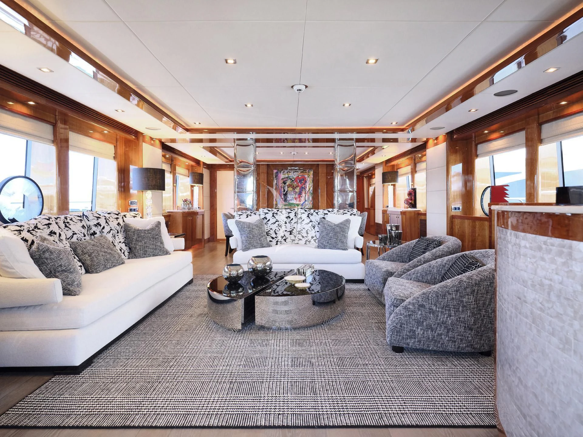 a living room with couches and a table aboard WHITE PEARL I Yacht for Sale