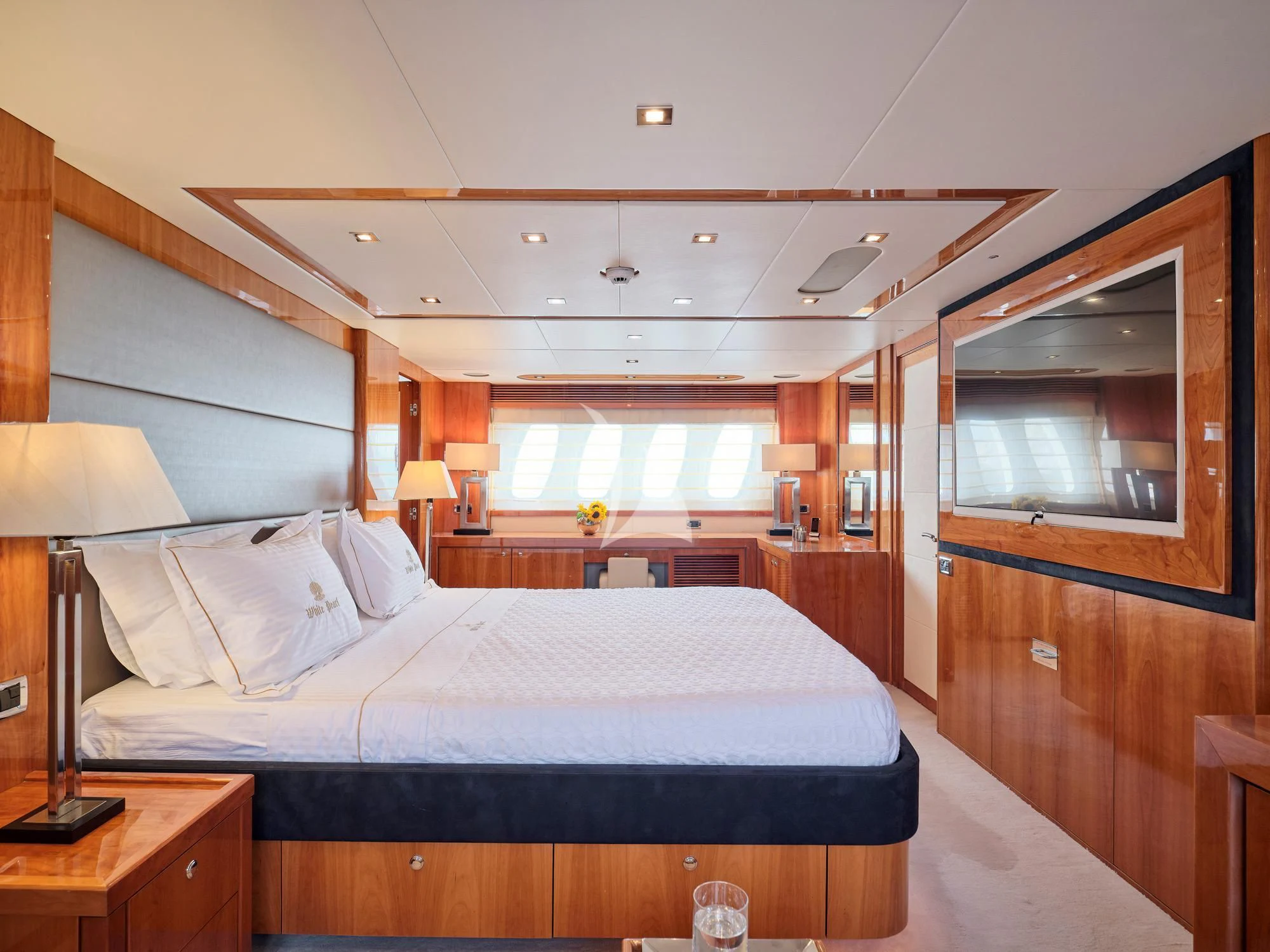 a bedroom with a large bed aboard WHITE PEARL I Yacht for Sale