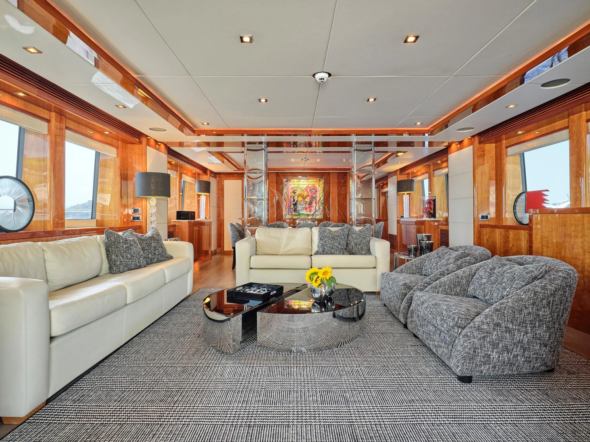 a living room with a couch and a coffee table aboard WHITE PEARL I Yacht for Sale