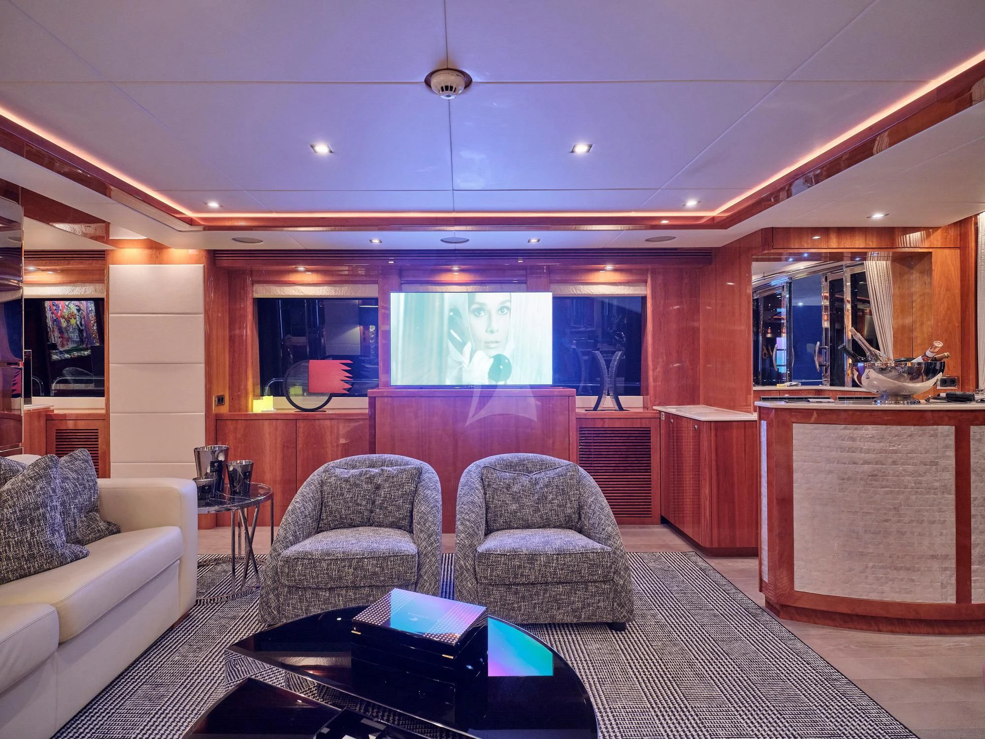 a living room with a couch and a coffee table aboard WHITE PEARL I Yacht for Sale